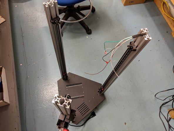 Carefully flip the machine upside down and set it on the ground on something like cardboard so at not to damage the machine.