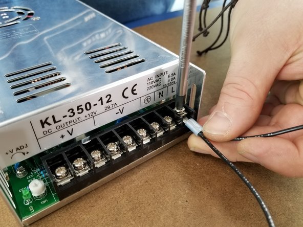 Start with the outermost screw on the power supply.  It is labeled with an L above the screw.