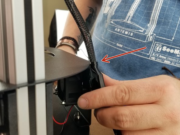 In Pic 2,  you want to align the cover for the 10 pin connector on the wires to the left side of the Y tower. This will set the distance of the whip to the proper length.