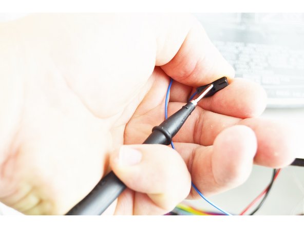 Determine which of the remaining existing wires is now connected to the blue 26awg wire that is in the 2 pin latching housing. Label it when you have determined it.