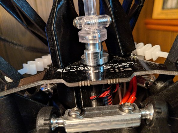 Install the 2 into 1 adapter into the hotend until you feel resistance.