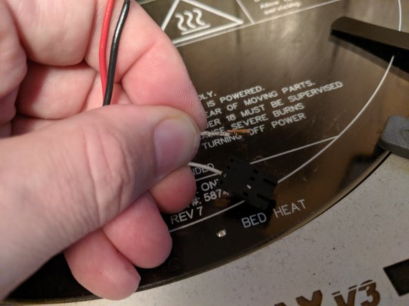 You will want to insert something pointy in this window while sliding the wire out of the housing.  Inserting something in the window will compress the clip that holds the clip in the housing