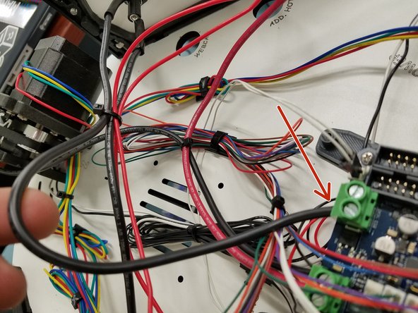 Install the 18awg red wire coming from the 5A HOT END FUSE into the screw terminal on the Duet Board as shown in the picture.