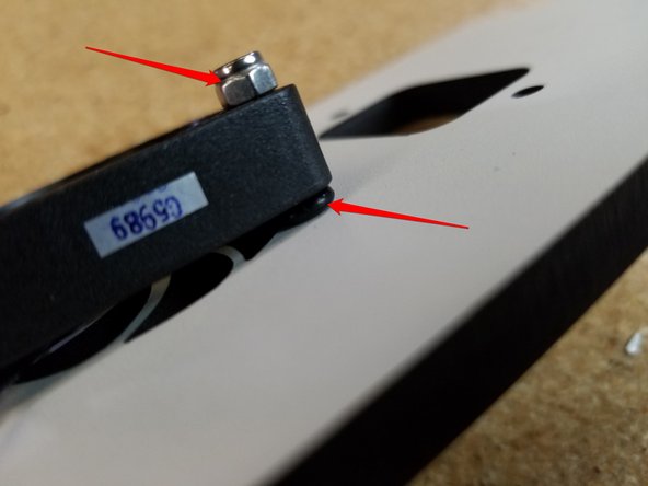 It is attached to the laser cut plate using (2) M3 22mm socket head bolts, (2) rubber o-rings, and (2) nylon lock nuts.