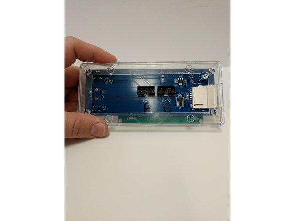 Insert the LCD enclosure back over the controller. This component has a boss that will line up with the SD card reader.