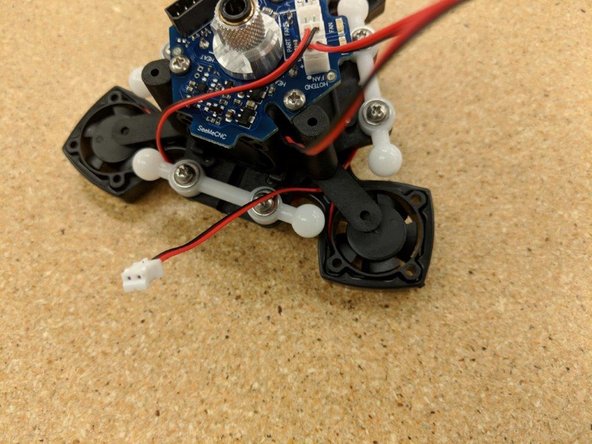 Route the fan leads as shown and plug into the JST connectors at the top of the PCB.