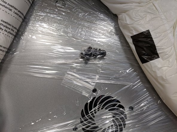 You can carefully remove the shrink wrap from the upper assembly. NOTE: There is a small package of press in rivets shrink wrapped to the top assembly. DO NOT LOSE THESE!