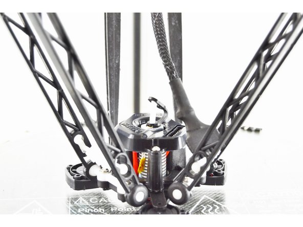 With the Bowden (PTFE) Tube pressed down, you will now lift up on the black ring in the top of the hot end.