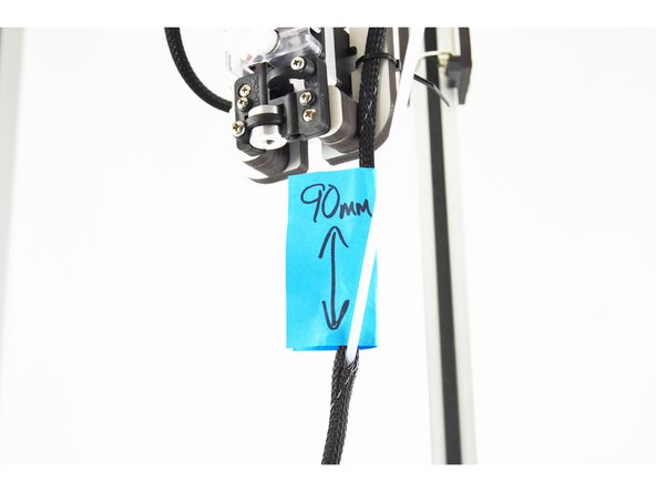 Work the bowden tube up through the mesh loom. It will exit the mesh loom approximately 90mm from the bottom face of the PTC adapter.