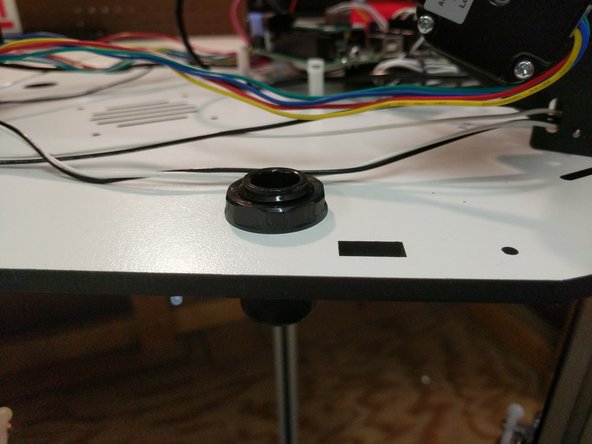 Install the Cable Nut / Whip Assembly in the hole between the X and Z towers. NOTE: In the images provided the whip is not present. 