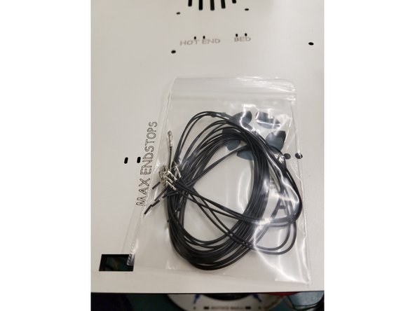 Strip back the existing end stop wire while being careful not to damage or cut to deep into the wire.