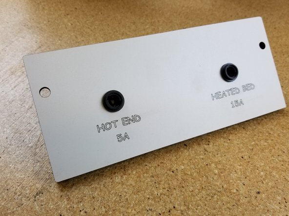 NOTE: If you purchased a machine after 8/22/2018 you will not need to install the 5A or 15A fuses. Your kit may not come with them, and will come with a blank side panel instead. The fuses are now built in to the Duet board. If this is the case, skip this step, we'll revisit this later in Step 50.