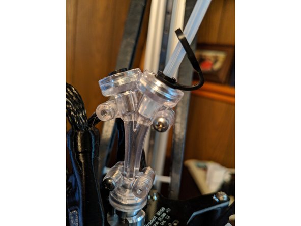 You should now have 2 approximately equal length pieces of PTFE tube.