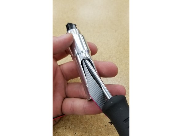 You may need to use a thin screwdriver or pen to help guide the cable connector through the post.