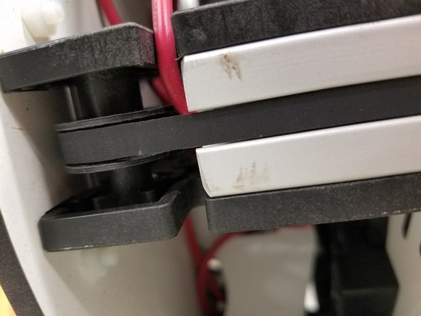 Make sure the belt is on the base idler bearing.