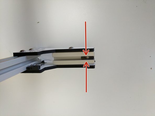 In this step and all other steps using the TSLOT nuts, the boss (ridge) on the nut should be facing away from the head of the button head screw.