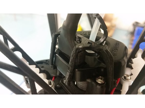 A whip clip is very useful for keeping your whip connector from coming loose during printing. You can download one from repables and print it, then fit it to your hot end.