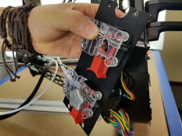 Place the EZR Struder plastics over the plate in the same orientation as the existing extruder.