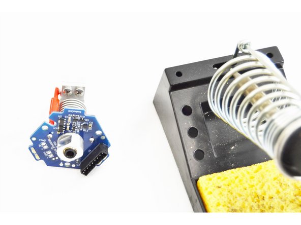 After the through hole connections have been soldered, trim the excess thermistor leads on the top side of the HE280 Hotend PCB board. These do NOT need to be flush with the board, we just need to ensure that they can not short against each other.