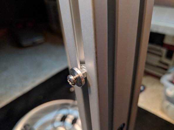 Rotate the hanger clockwise to lock it in the rail and tighten the screw as shown in Figure 2.