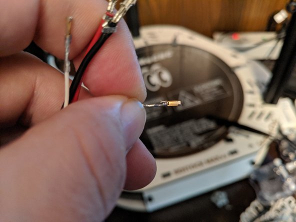 You can see in Pic 1 the small tab that has now been compressed.  Using a fingernail, GENTLY lift the tab so it can click back into place when re-inserted.