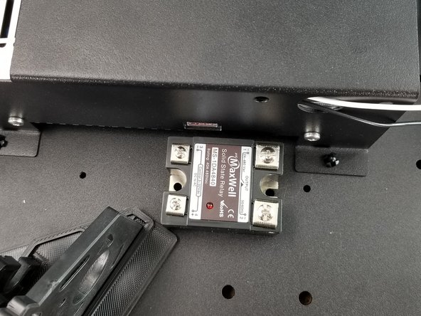 Line up the solid state relay next to the power supply as shown in Pic 3.  Make sure the orientation of the relay is as shown in the picture with the output of the relay towards the center of the machine, and the input towards the edge of the machine.