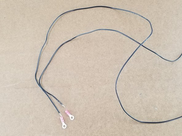 This step will use the two longest black wires from the pack.  Also you will use two small red ring terminals.