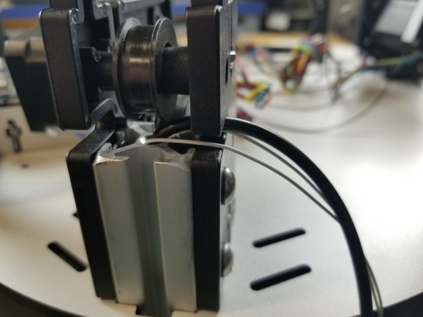 You will have to first pass the wires up through the holes in the plate of the base assembly.