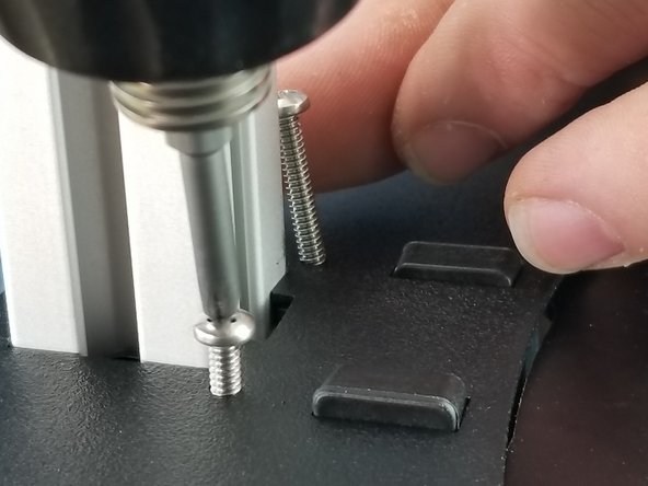 In front of each tower will be 2 holes that will secure the sheet metal cover to the tower brackets.