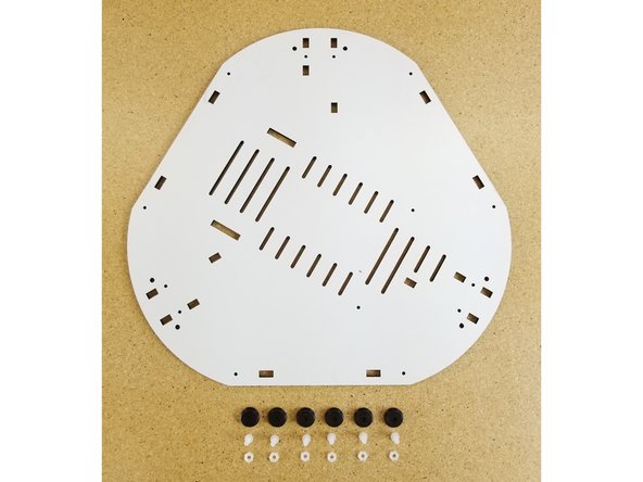 Install the feet on the base bottom plate. The feet install in the locations shown and should be on the opposite side of the plates identifying X Y &amp; Z marks.