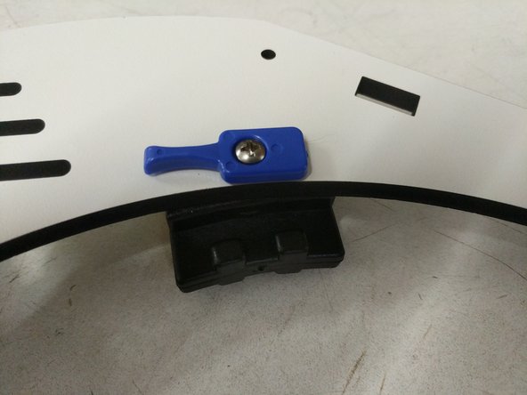 Using 6-32 x 1&quot; phillips pan head machine screws, gently tighten as shown. Blue bed clamps should rotate very easily, but not be loose.