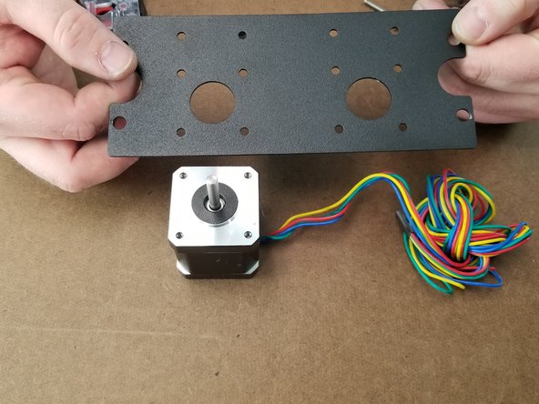 Here we will attach the motor and ezr struder to the extruder plate.