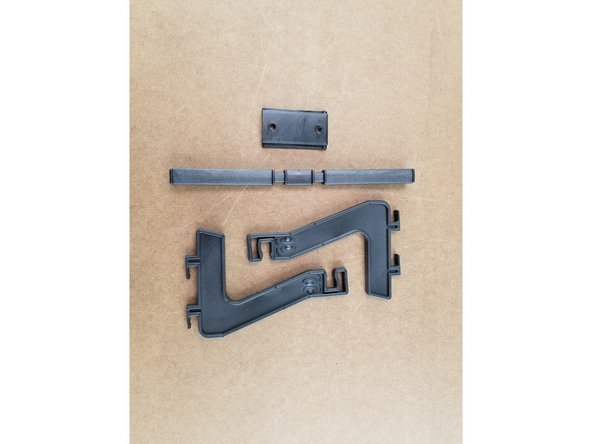 We will now install the spool holder.  This will use 2x spool holder side plates, the spool holder cross brace, and the clamp plate for the spool holder as shown in Pic 1.  You will also need 2 nylon push rivets.