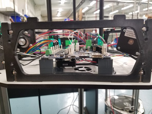 Using the same 6-32 x 1&quot; L screws you removed from the panels in the beginning. Screw the 3 Injection Molded Side Panels back in to the Laser Cut Melamine.