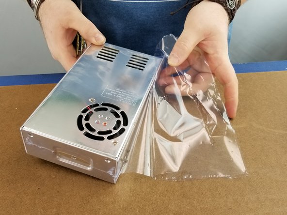 Remove the plastic covering on the power supply.