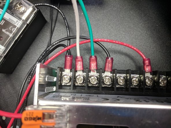 You will install these onto the power supply input. Remove the screws on the ground and N (neutral) terminals.