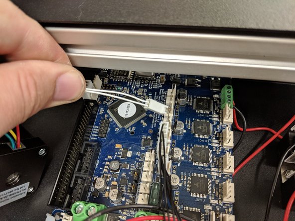 The hotend thermistor connector (2-pin 2 white wires, exiting the X tower wire bundle) is keyed and will only connect in one direction in the location indicated in the photo.