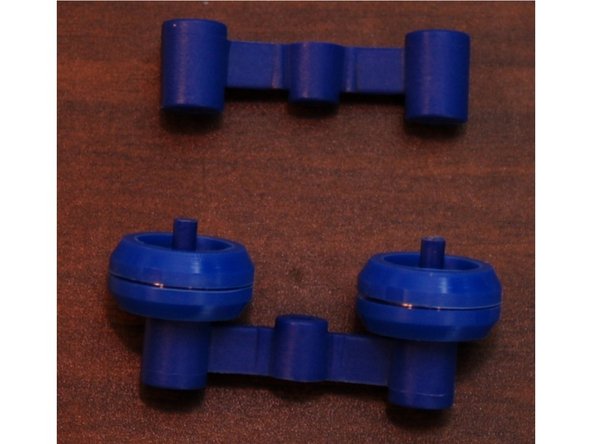 Set two RZ44 bearings on the inner spring arm as shown in photo #2.