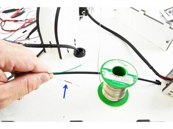 Notice in the first picture that the lead has been marked. (labeled with a blue arrow). This lead will be soldered to the green wire from the new hotend whip.