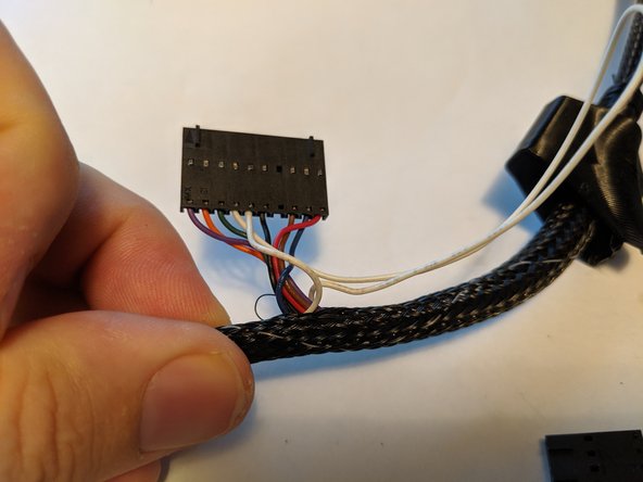 You will have excess white thermistor wires sticking out of the harness.  You will want to feed that wire back into the loom heading down where they came out of towards the red and black plugs.  You can see the wire fed back in Pic 1.