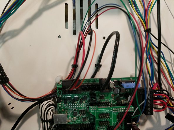 You should begin by connecting the red and black 18awg wires to a 2 position terminal block (found in RAMBo kit). Note the polarity in the photo.