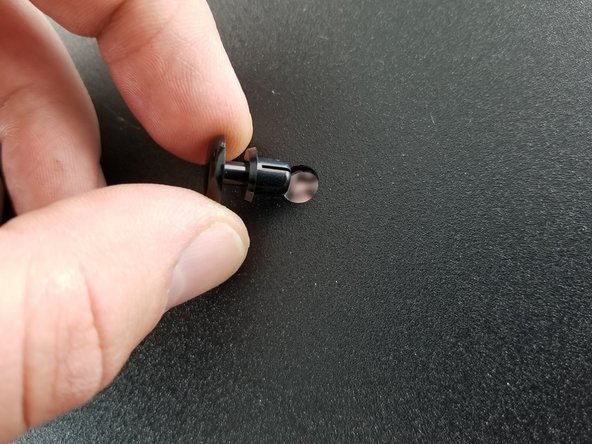 From the underside of the base sheet metal plate, insert the nylon rivet through the base plate and through the power supply bracket tabs.