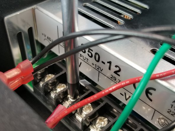 Feed the wire through the power supply bracket hole as in the previous step shown in Pic 1.