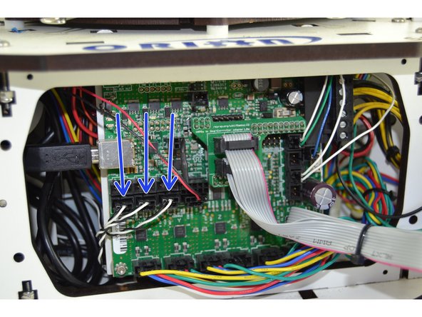 You will need to first angle the RAMBo board and insert the top into the base of the printer. You need to get the two tabs to align with the slots on the top plate of the base.