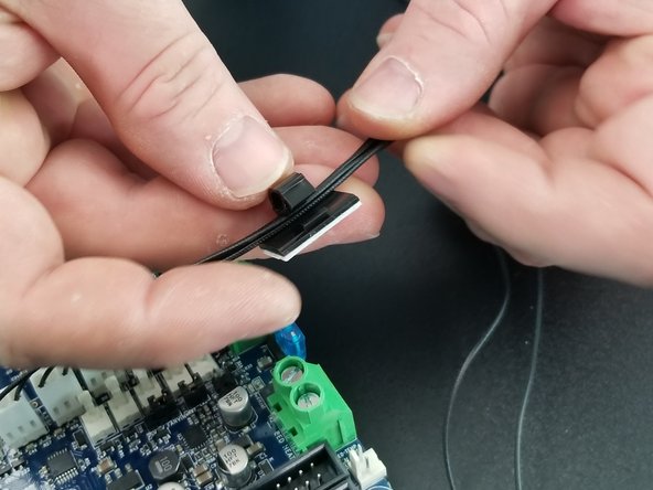 Insert all 6 enstop wires into the clip and lock the clip down in place.  It will snap to secure the wires.