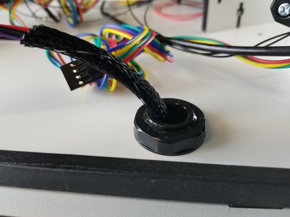 After installation, you will feed the hot end whip  (end without connectors) up from the bottom through the  strain relief.  Do not tighten at this time.