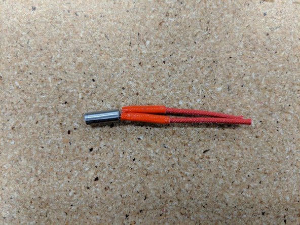 Slide one tube on one of the wires and work it down over the crimps until fully seated near the heater cartridge.  Repeat this process on the other leg of the heater. The previous 11mm and 7mm cut lengths will give a result as in Pic 3.