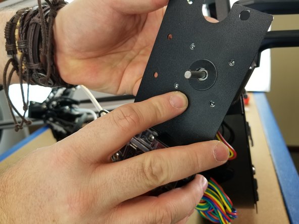 Line up the motor screw holes with the holes on the extruder plate.