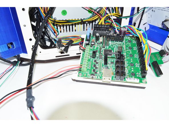 There are 3 wires that will connector to the top left corner of the RAMBo output terminals. These wires are the 18awg red, 18awg black, and 26awg orange.