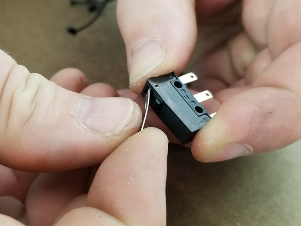 The lock nuts should have already been installed in the black brackets in step 5.